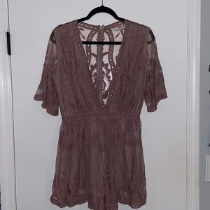 Deep V Summer Romper in a light lavender shade with mesh and lace detail.